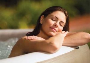 Woman Relaxing in an Intex Spa at the End of the Day