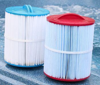 Different Spa Filter Cartridges Sitting on Edge of Hot Tub